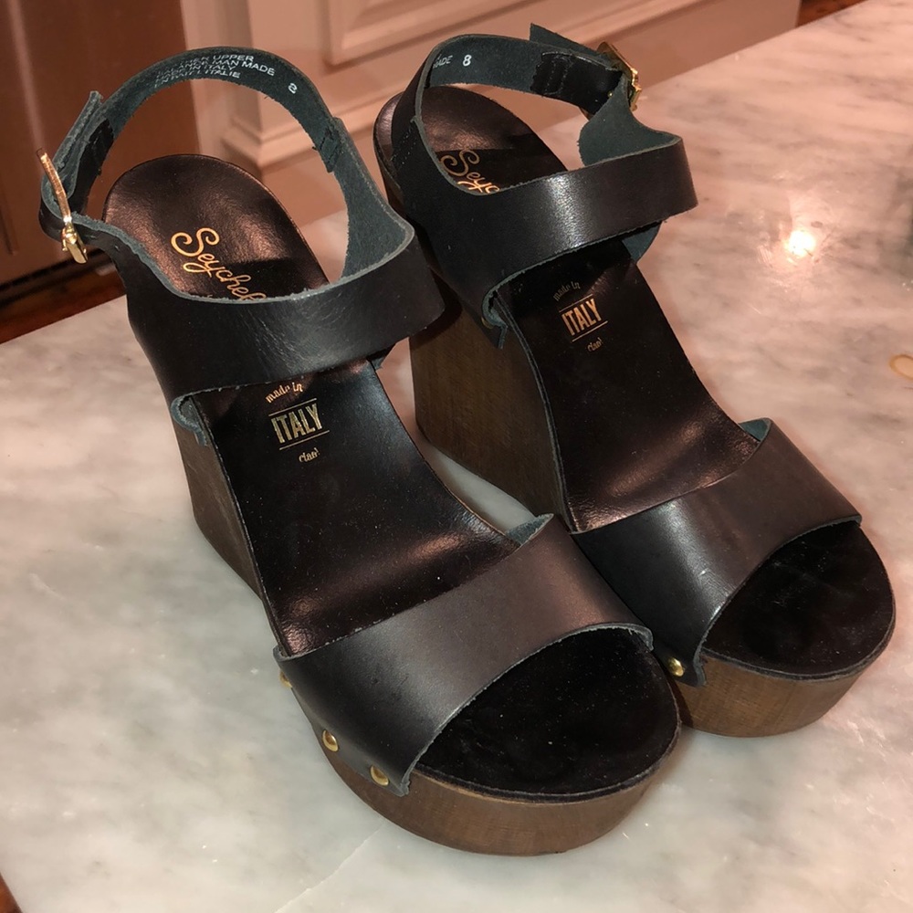 Black leather and dark wooden wedges